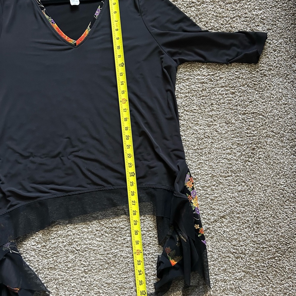 Black top with floral trim. - Picture 7 of 9